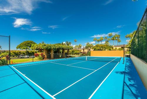a tennis court with a net on it at Wailea Elua by Coldwell Banker Island Vacations in Wailea