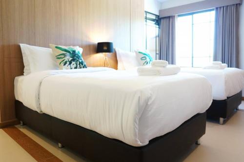 Katil atau katil-katil dalam bilik di Hotel Matana