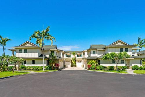 a large house with palm trees and a driveway at Big Island Na Hale O Keauhou by Coldwell Banker Island Vacations in Kailua-Kona