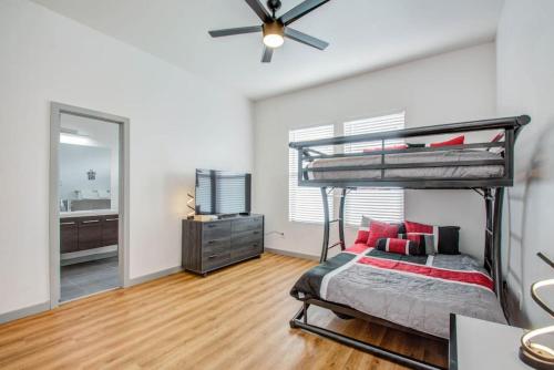 a bedroom with a bunk bed and a mirror at Modern 4 Bedroom 4 Full Bathroom Near Downtown in Houston