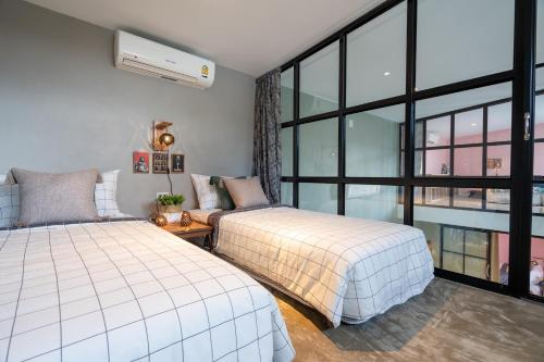 Ένα ή περισσότερα κρεβάτια σε δωμάτιο στο Manao Seaview Pool Villa 18 - 3 Mins Walk To The Beach