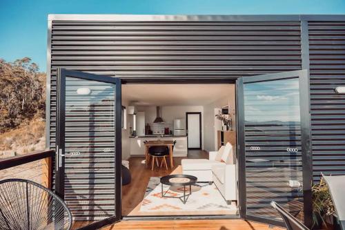 a living room with a view of the ocean from a house at Seascape on Bruny - Family Home in Alonnah in Alonnah