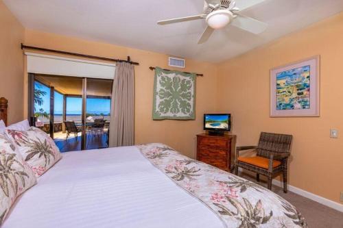 a bedroom with a bed and a ceiling fan at WAILEA ELUA, #0307 condo in Wailea