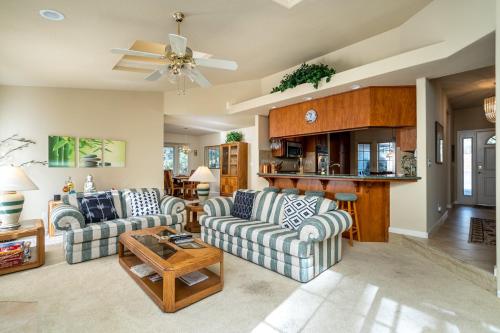 a living room with two couches and a table at Happy Trails - Updated 3-Bedroom Home with Cozy Sunroom and Spacious Deck home in Groveland