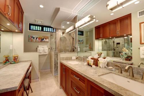 a large bathroom with two sinks and a shower at WAILEA ELUA, #1403 condo in Wailea