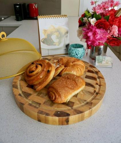 a plate of pastries and croissants on a table at Cloudland Garden Oasis in Blackheath