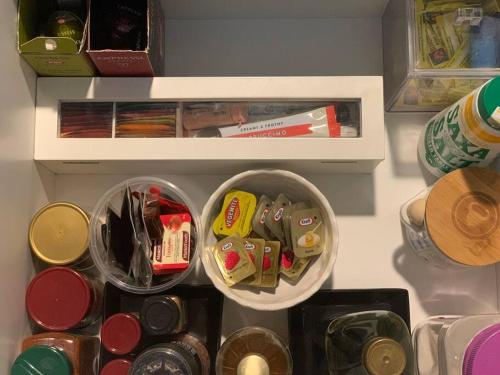 a refrigerator filled with lots of food and drinks at Cloudland Garden Oasis in Blackheath
