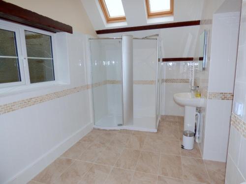 a bathroom with a shower and a sink at Great Barns in South Pool