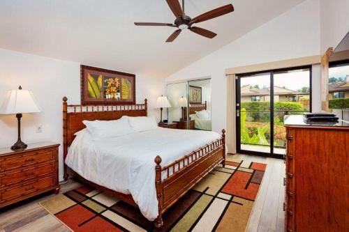 a bedroom with a bed and a ceiling fan at WAILEA ELUA, #0702 condo in Wailea