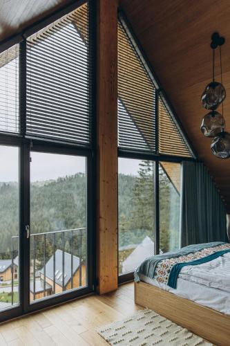 Postel nebo postele na pokoji v ubytování SKOGUR - Home & Resort