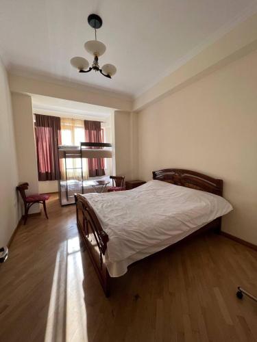 a bedroom with a large bed in a room at ArevaHostel&Apartment in Yerevan