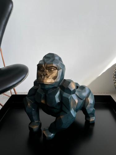 a statue of a gorilla sitting on a table at Planet 23 in Chiayi City