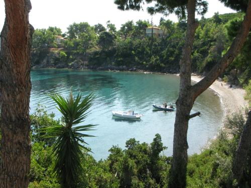 two boats in the water on a river at Marianna Studios in Aghios Petros Alonissos