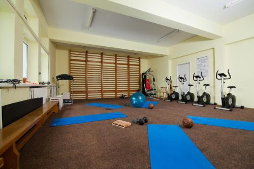 a room with a gym with exercise equipment on the floor at Hotel Montana - Covasna in Covasna