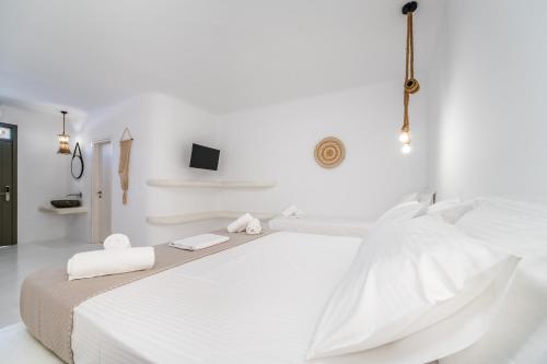 Ένα ή περισσότερα κρεβάτια σε δωμάτιο στο Amethyst Luxury Suites Oia