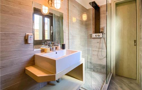 a bathroom with a sink and a shower at Beautiful Home In Samos With Outdoor Swimming Pool in Kámpos