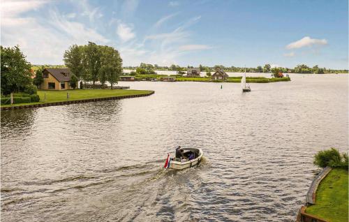 a small boat in a large body of water at Amazing Home In Grou With Wifi in Grou