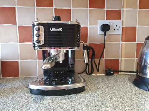 a coffee maker sitting on top of a counter at Ballycotton Holiday Apartment No 6 by Trident Holiday Homes in Ballycotton