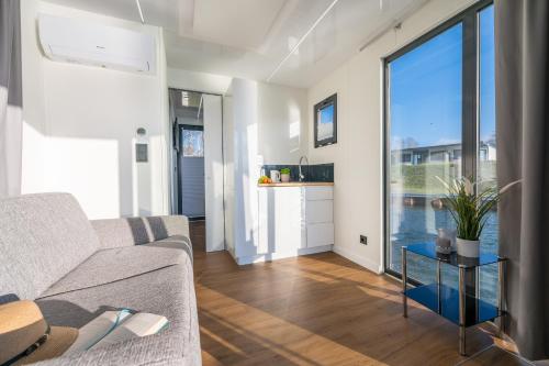 a living room with a couch and a table at Marina Martinshafen in Sassnitz