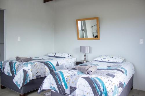 Katil atau katil-katil dalam bilik di Wings Self-catering Apartment Suiderstrand