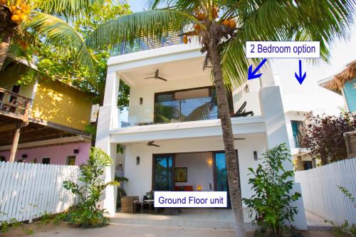 a house with the front elevation and the ground floor unit at Bella Luna Beach Home #64708 in West End