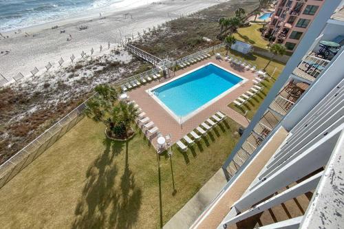 an overhead view of a swimming pool and the beach at Sunswept 702 condo in Orange Beach