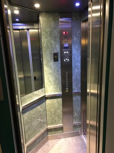 a elevator in a building with a glass door at Hotel Arlette Beim Hauptbahnhof in Zurich