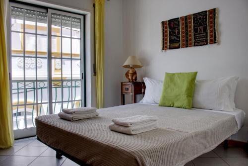 Postel nebo postele na pokoji v ubytování Cabanas Downtown