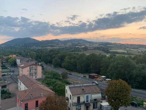 a view of a town with mountains in the distance at La terrazza sul Trebbia in Rivergaro