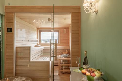 a sauna with a glass door in a room at Podere Val D'Orcia - Tuscany Equestrian in Sarteano
