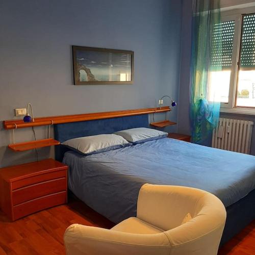 A bed or beds in a room at MìCè ottima soluzione per il centro e la Svizzera