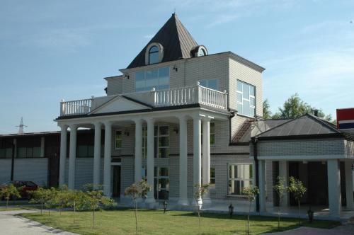 a large house with a turret on top at Vila Lux Milikic in Kraljevo