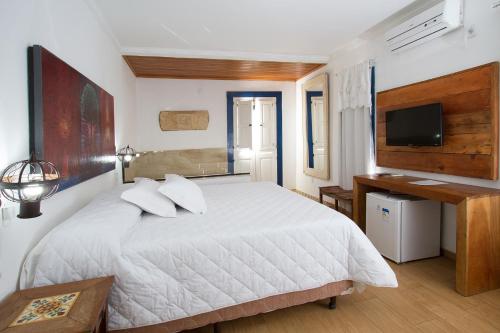Ένα ή περισσότερα κρεβάτια σε δωμάτιο στο Hotel Serra Vista