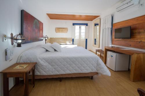 Ένα ή περισσότερα κρεβάτια σε δωμάτιο στο Hotel Serra Vista