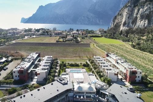 an aerial view of a resort with a mountain in the background at Bertoldi Terme sul Garda - Matthew in Nago-Torbole