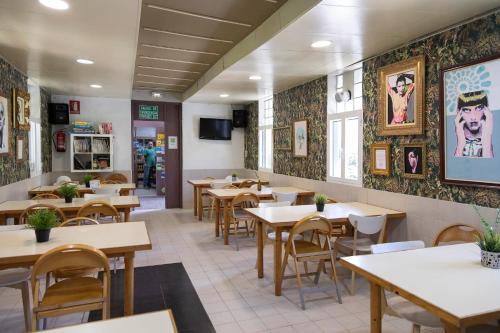 a dining room with tables and chairs in a restaurant at Camping Alta Ribagorça in El Pont de Suert