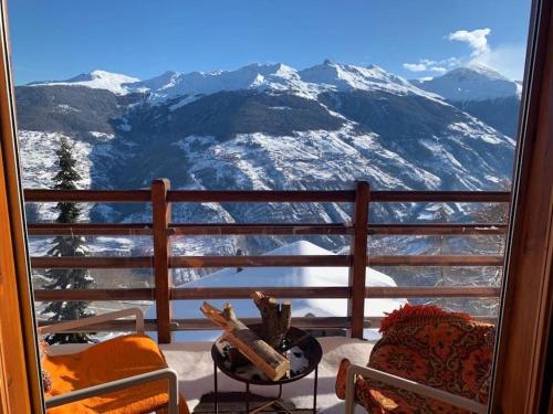 a balcony with a view of a snow covered mountain at Chalet , Thyon Les Collons, 4 Vallées in Les Collons