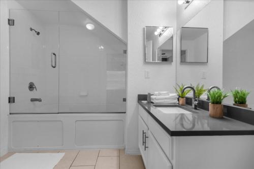a white bathroom with a sink and a shower at Seven Dwarfs 10-105 Lc - 3 Bedrooms 2 Bathrooms in Orlando