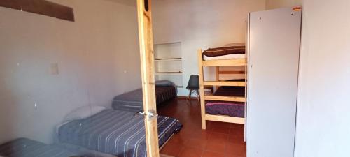Postel nebo postele na pokoji v ubytování Hostal del Desterrado