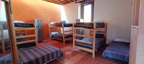 Postel nebo postele na pokoji v ubytování Hostal del Desterrado
