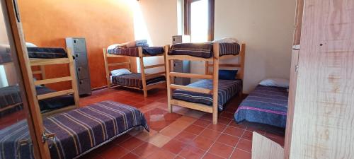 Postel nebo postele na pokoji v ubytování Hostal del Desterrado