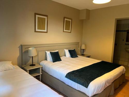 Giường trong phòng chung tại Appart'Hotel Festival Sud Aqua - Avignon TGV