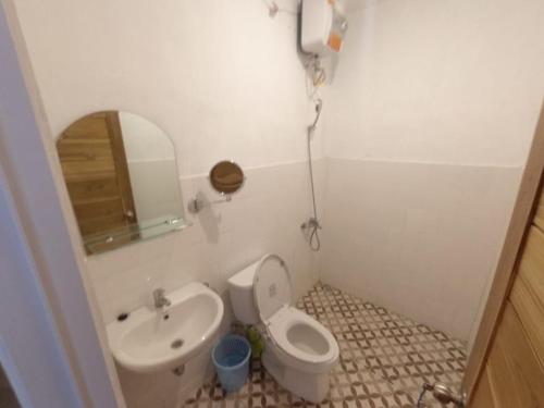 a small bathroom with a sink and a toilet at Villa Sawah Prambanan in Randugunting