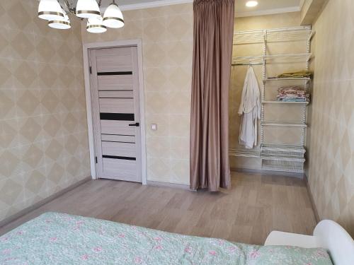 En eller flere senge i et værelse på Апартаменты