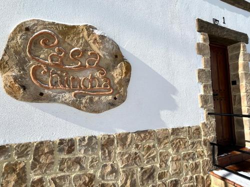 a rock on the side of a building at Casa Rural Chincha in Tragacete