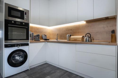 Cuisine ou kitchenette dans l'établissement Apartmán LM