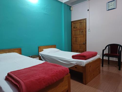 Postel nebo postele na pokoji v ubytování Odyssey Stays Jowai - West Jaintia Hills