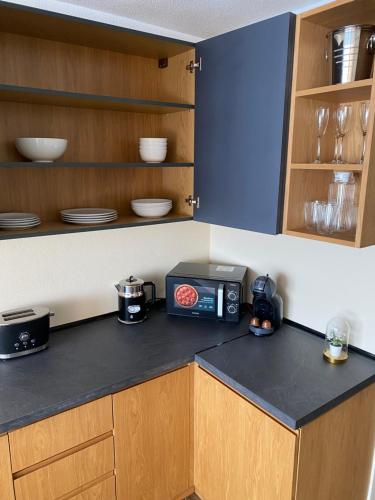 a kitchen with a counter with a radio on it at El Patio Hostal in Alicante
