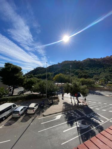 a view of a parking lot with cars parked at El Patio Hostal in Alicante