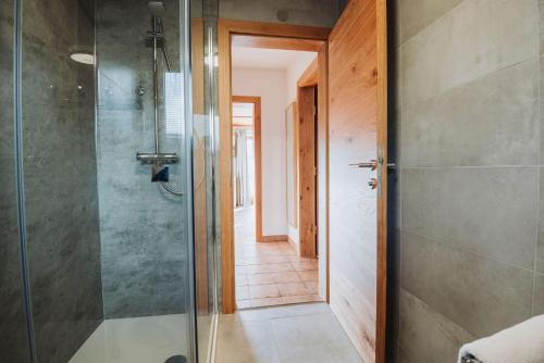 a bathroom with a shower with a glass door at Appartement Stern Dagmar in Neustift im Stubaital